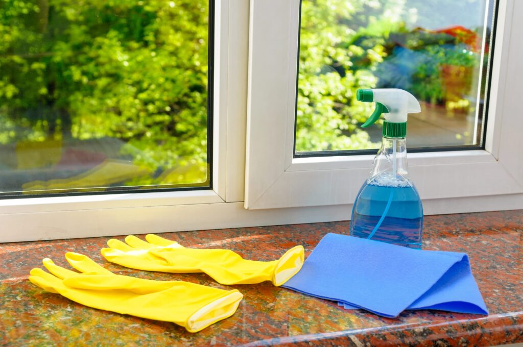 Cleaning supplies in front of vinyl window