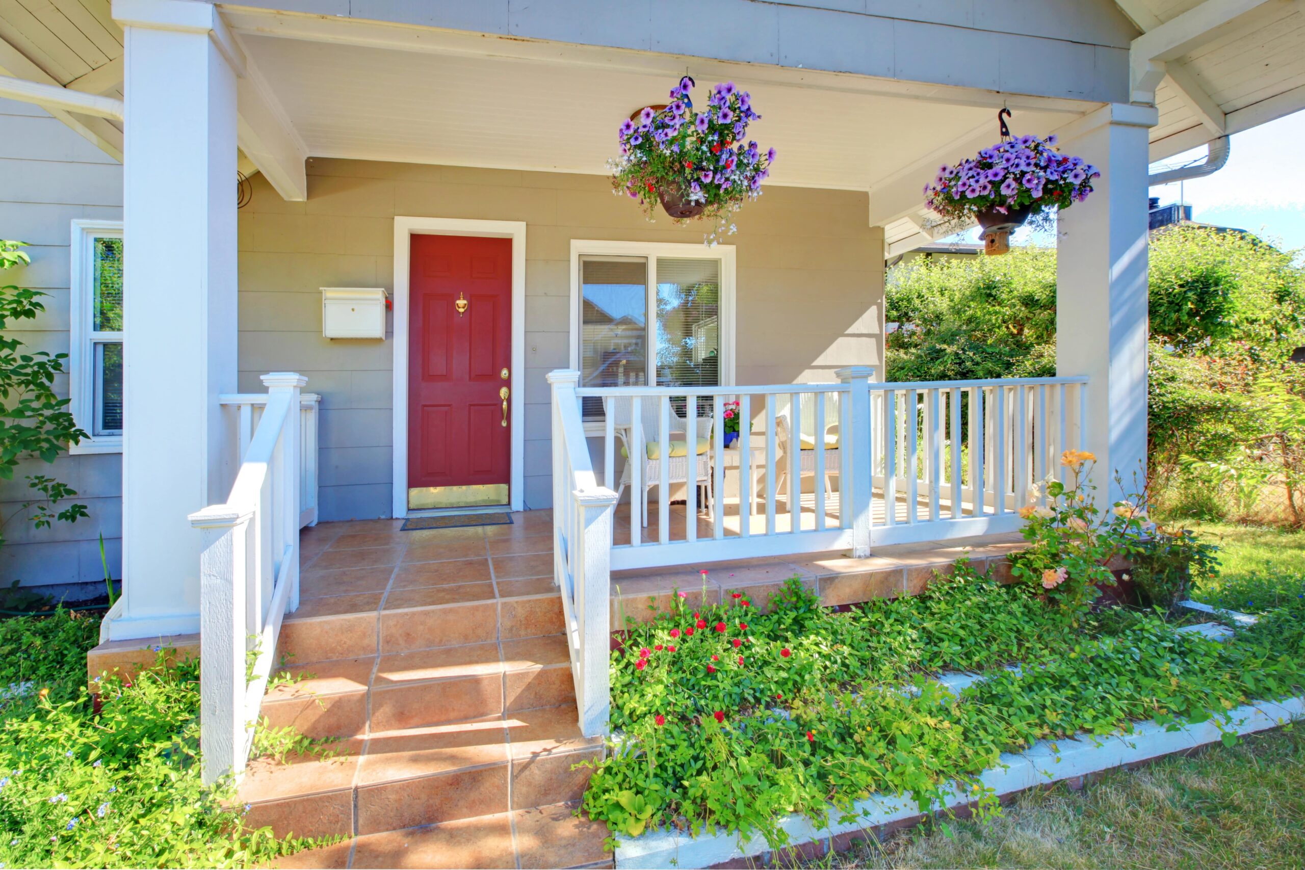 Red front door of home in summer