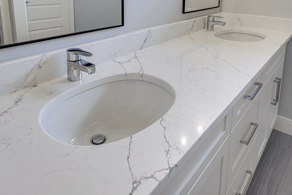 Remove BG Save Share Sample The bathroom sink is white and has a silver faucet